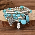 Detail of bohemian turquoise beaded bracelets with silver cactus and leaf pendants - Style 05