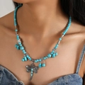 Bohemian turquoise beaded necklace featuring a large dragonfly pendant and butterfly charms - Turquoise Blue Dragonfly Butterfly Style