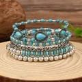 Detailed shot of bohemian multi-layer turquoise bead bracelets and vintage silver bangles - Flat Beaded Vintage Wide Band Style (RH765-Style 17)