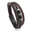 Macro detail of multilayer braided leather bracelet with magnetic buckle and metal beads - Brown Leather Black Clasp