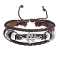 Détail d'un bracelet en cuir tressé multicouche avec feuille d'argent et perles - Style de Branche / Marron