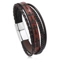 Macro detail of men's multilayer braided leather bracelet with cross pattern and magnetic clasp - Brown Leather Silver Clasp