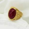 Macro shot of vintage gold ring featuring a large red gemstone and intricate floral carving - US 7 / Gold Band + Red Stone