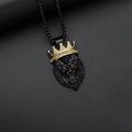 Detailed view of hip hop lion head pendant with gold crown and sparkling red gem eyes - Gold And Black Pendant Only (Without Chain)