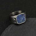 Detailed close-up of a vintage Viking steel ring featuring a blue stone inlay and carvings - Silver Lapis Lazuli
