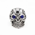Retro punk skull ring in silver steel featuring deep blue gemstone eyes on white background - US 7 / Blue Evil Eye