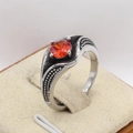 Detail of a vintage titanium steel ring with a large oval orange gemstone and bead textures - US 7 / Red Zirconia