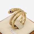 Anillo de serpiente vintage dorado con textura de escamas y ojos de piedra azul - Dorado Ojo Azul