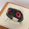 Gothic owl ring in black titanium steel with striking red gemstone eyes on a velvet tray - US 7 / Red Eye