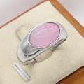 Minimalist silver steel ring with a smooth oval pink gemstone on a display stand - Steel Color Pink Stone
