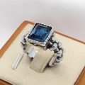 Vintage braided silver chain ring with a large rectangular blue gemstone on a beige stand - US 7 / Steel Color Blue Rhinestone