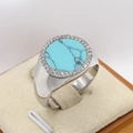 Chunky silver signet ring featuring round turquoise stone and halo of white crystals - US 7 / Steel Green Stone