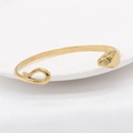 Minimalist gold snake-shaped open bangle featuring a sleek abstract animal design for men - Gold