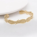 Vintage golden feather cuff bracelet in stainless steel with detailed wing textures - Gold