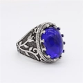 Vintage oval blue gemstone ring with intricate floral carvings on silver steel band - US 7 / Blue