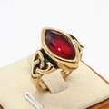 Vintage Celtic knot gold-plated ring with a marquise red gemstone in a 45-degree view - Gold Red Stone