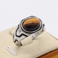 Men's vintage titanium steel ring featuring an oval tiger eye stone with silver accents - Size 7 / Brown Yellow (Tiger Eye)