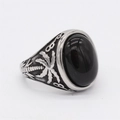 Bague rétro en acier avec pierre ovale noire et détails gravés de palmier - US 7 / Pierre Noire