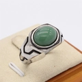 Vintage silver titanium ring with an oval green gemstone and black geometric lines - Size 7 / Light Green