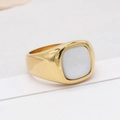 Modern gold-plated stainless steel signet ring with a white shell inlay on white surface - US 7 / Gold