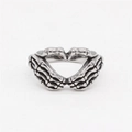 Retro stainless steel skeleton hand heart ring with punk gothic aesthetic and silver finish - US 7 / Steel