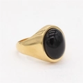 Bague minimaliste en titane doré ornée d'une pierre œil de chat noire ovale polie - Or Pierre Noire