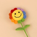 Handmade crochet rainbow sunflower with a smiling face on a green stem and leaves - Petal Rainbow Smiling Sunflower / Rainbow Seven-Color