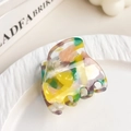 Colorful acetate hair claw clip with artistic multicolor resin patterns and five teeth - Yellow & Green