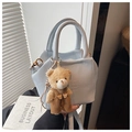Light blue faux leather shoulder bag with a cute plush bear pendant and textured finish - Blue with Charm