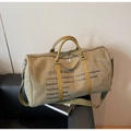 Olive green travel duffel bag with yellow faux leather handles and adjustable shoulder strap - Green