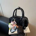 Glossy black bowling bag with pompom charm and adjustable strap for women - Black with Pendant