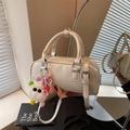 Chic cream white bowling bag with plush monster charm and adjustable shoulder strap - Beige With Charm
