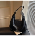 Vintage black dumpling tote bag with textured faux leather finish and silver metal rings - Black