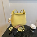 Yellow drawstring bucket bag with litchi texture and a cute puppy plush pendant - Yellow