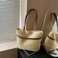 Large beige woven straw tote bag with brown leather handles and gold metal buckle detail - White