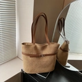 Handwoven straw tote bag with brown leather straps and metal buckle for summer beach use - Khaki