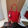 Chic red lychee pattern bucket bag with heart charm and silver chain strap for women - Burgundy