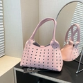 Pink lychee leather hobo bag with metal eyelet decor and dual top handles in pink - Small Eyelet Pink