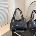 Minimalist black leather tote bag with silver eyelet details and dual top handles - Large Eyelet Black