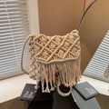 Handwoven cream straw bag with diamond mesh pattern and bohemian fringe details - Off White
