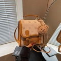 Mini crossbody backpack with deer pattern, orange leather trim, and plush bear charm - Brown with Pendant