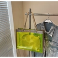 Detail of neon green transparent PVC tote with woven rope handles and inner pouch - One Size / Green