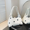Chic off-white leather shoulder bag featuring stylish oversized silver metal eyelets - Large Eyelet White