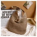 Detailed view of woven straw tote bag with fabric lining and secure magnetic metal closure - Khaki