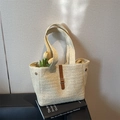 Chic woven straw tote bag in light beige with brown leather accent and metal buckle - Off White