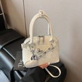 Chic cream white glossy shell bag with silver chain and oversized heart charm detail - White