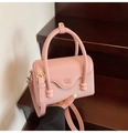 Pink French-style crossbody bag with textured weaving and cylindrical top handle - Pink