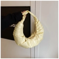 Ruched cream yellow crescent shoulder bag in glossy faux leather with pleated design - Yellow