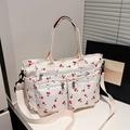 Minimalist beige tote bag featuring red cherry prints with double front zip pockets - White