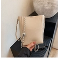 Beige litchi leather bucket bag with silver chain strap and cute bear charm pendant - Gentle Apricot